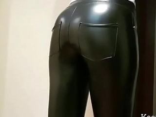 Leather Girl in tight pants coupled with scornful high-heeled slippers